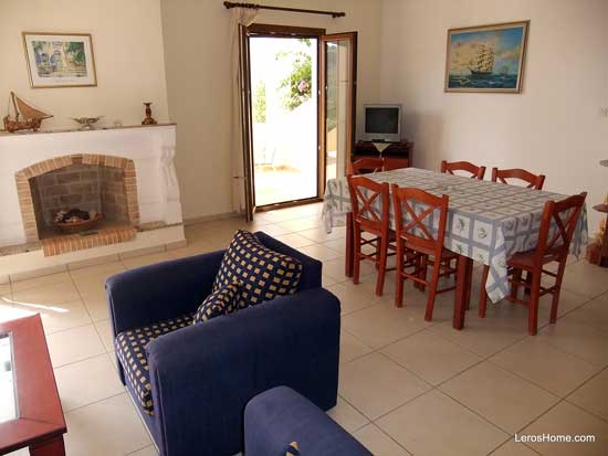 dining table, fireplace and patio door