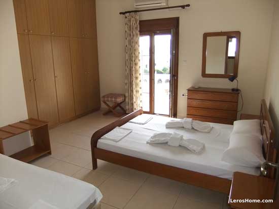 bedroom showing fitted wardrobes and child bed